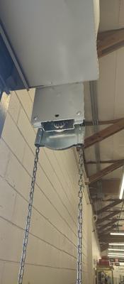 Before — Commercial Roll-Up Door Repair After Forklift Damage