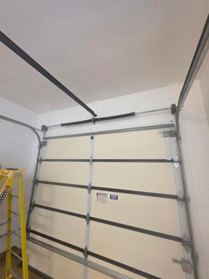 Wood Garage Door Panel Repair and Track Realignment