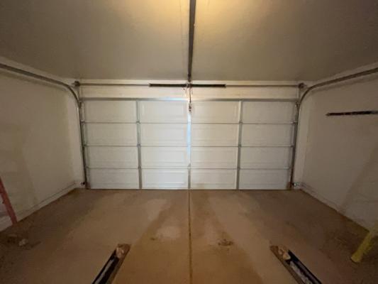 Before — 16x7 Sectional Garage Door Installation with Steel Panels