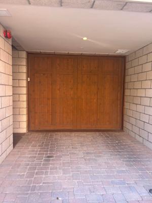 Custom Wood Overlay Garage Door Installation with Smart Opener