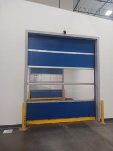 High-speed door with blue panels partially open