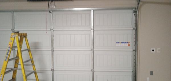 Garage Door Spring Pad Repair & 17-Point Maintenance