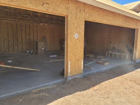 Before — Dual Sectional Garage Door Installation with Smart Openers