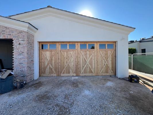 After — Custom Wood Garage Doors with Smart Opener Installation