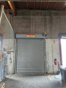 Commercial roll-up door closed in warehouse