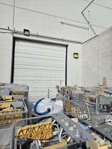 Aerial view of commercial door installation with equipment