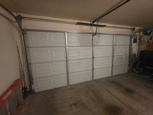 Garage Door Opening on Its Own - Diagnosis & Adjustment